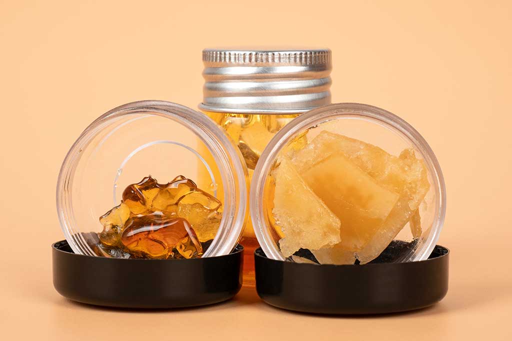 bottles-with-different-varieties-of-cannabis-golden-wax-extract